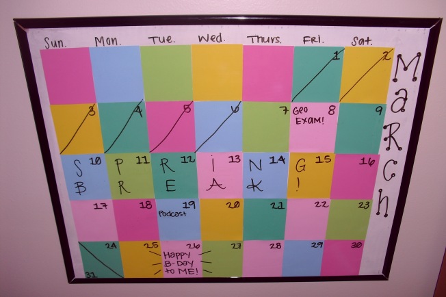 A calendar using paint samples and a poster frame. 